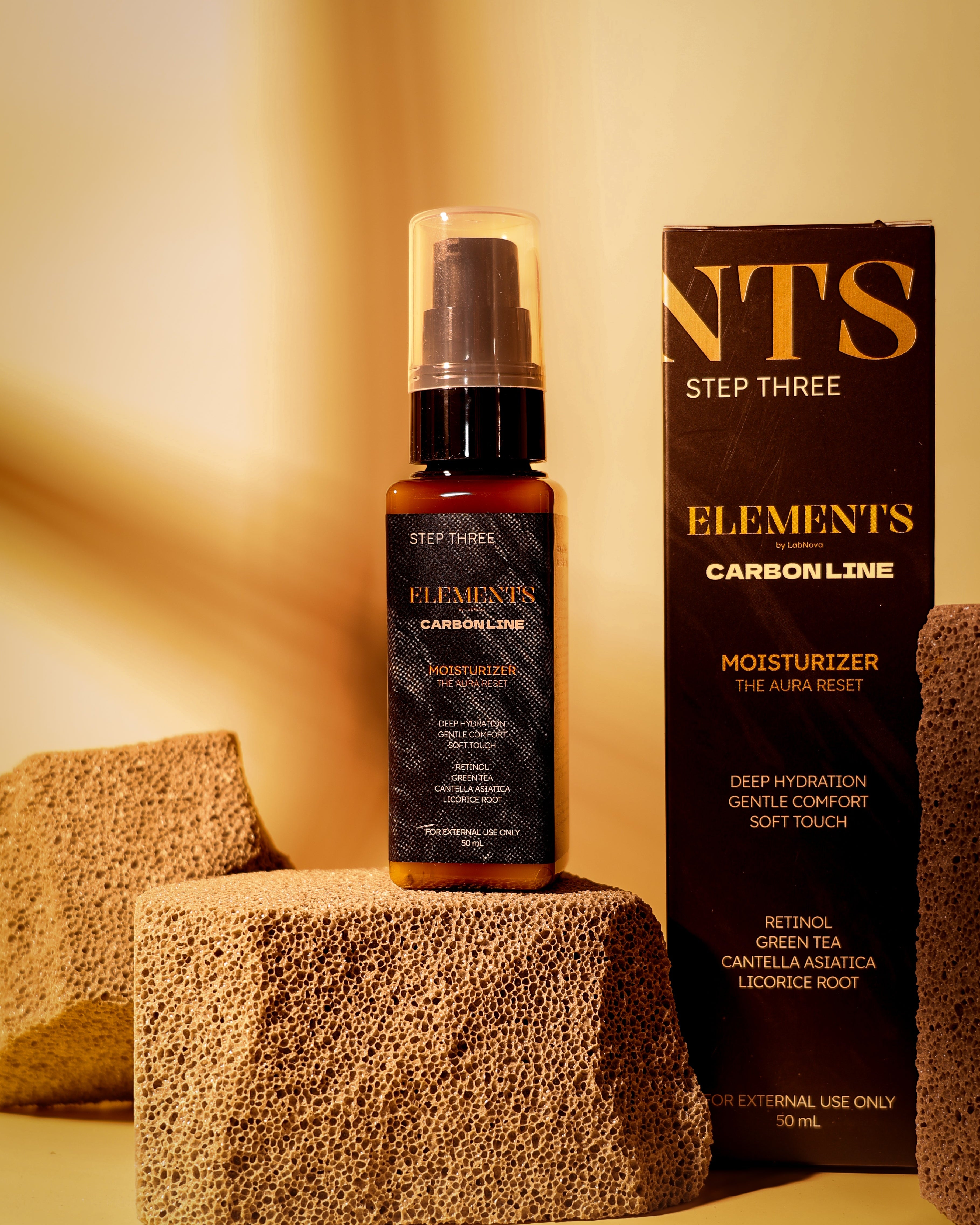 Skincare bottle and packaging on a textured surface with a warm glow